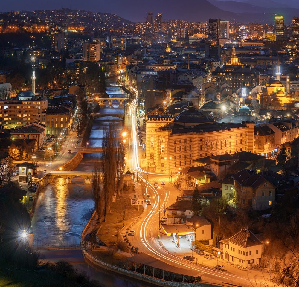 Sarajevo at night, view over the Miljacka river and City Hall